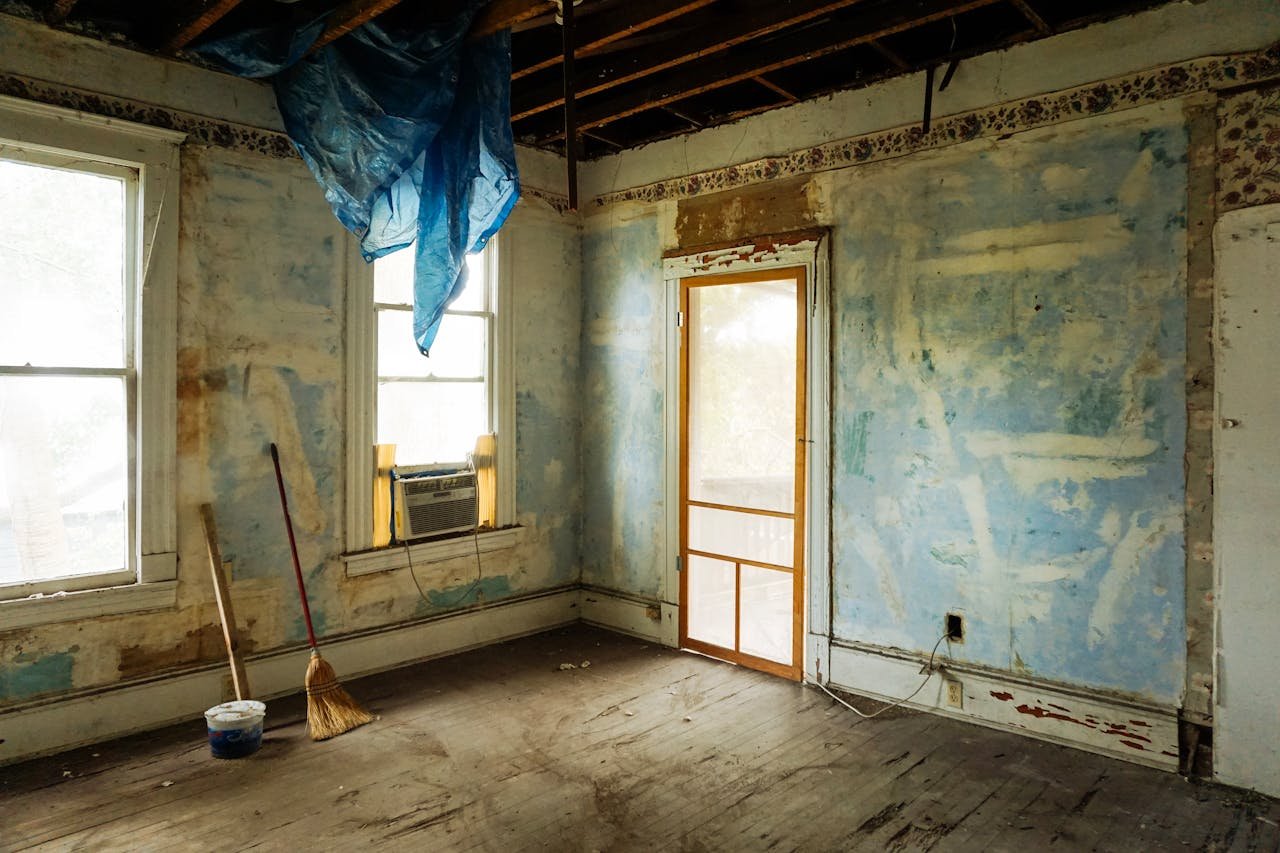 Crafting Captivating Headlines: Your awesome post title goes here An empty room in an abandoned house with peeling walls and construction tools.
